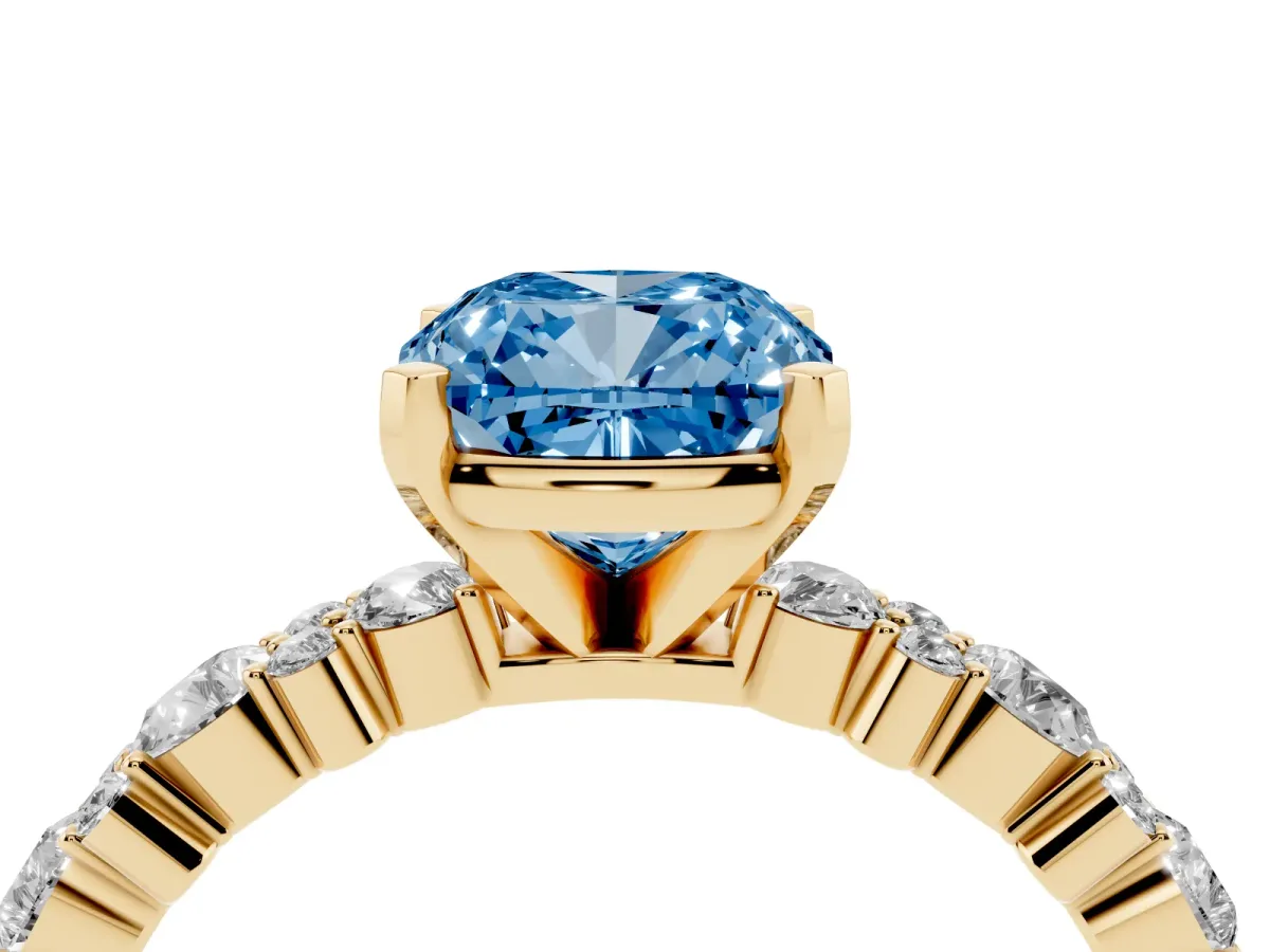 Fancy Blue Cushion Cut Diamond Side Stone Solitaire Ring with Round and Four-Prong Setting Yellow gold