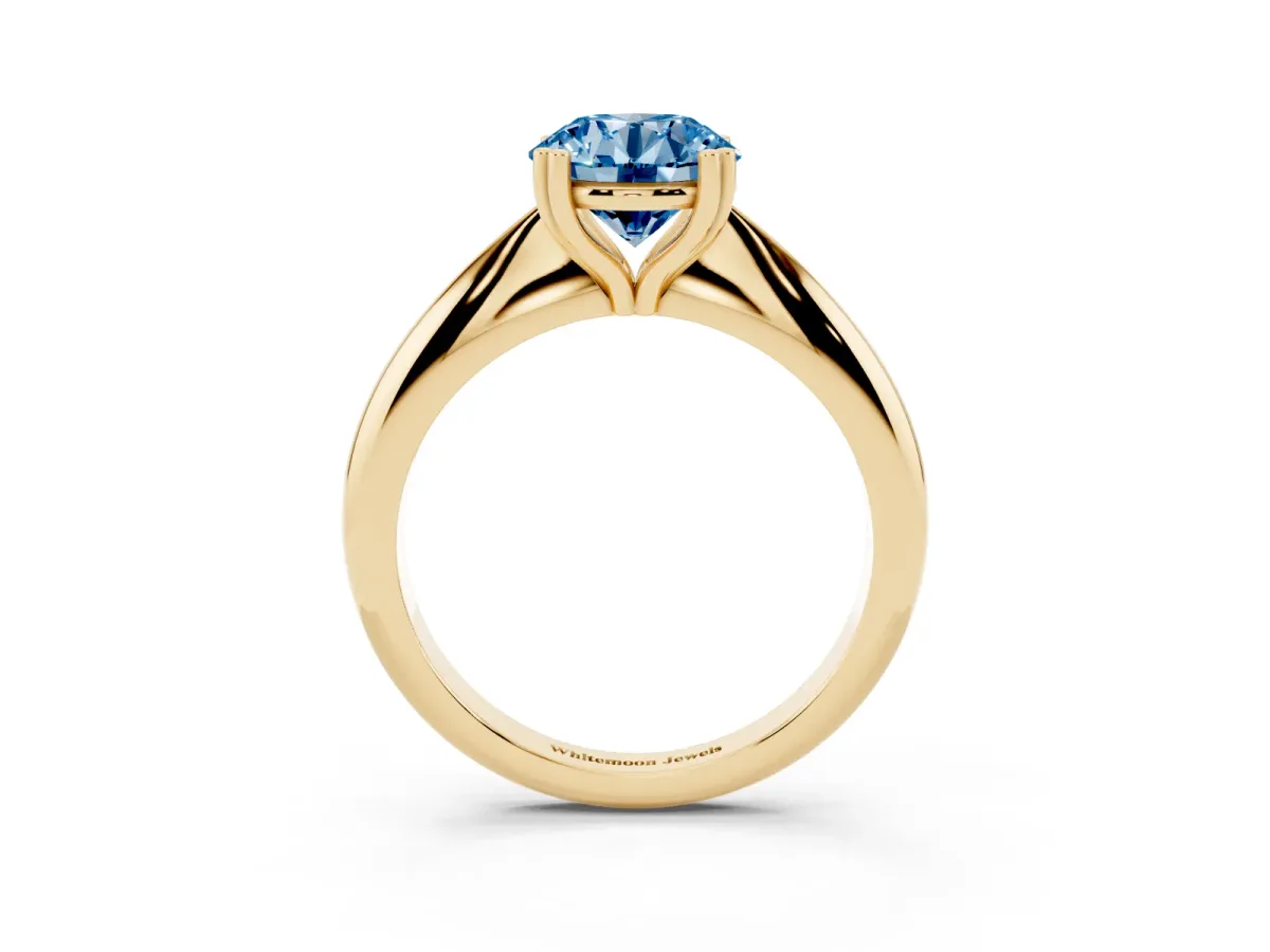 Fancy Blue Round Cut Cut Solitaire Engagement Ring with Tapered Band and Four-Prong Setting Yellow gold