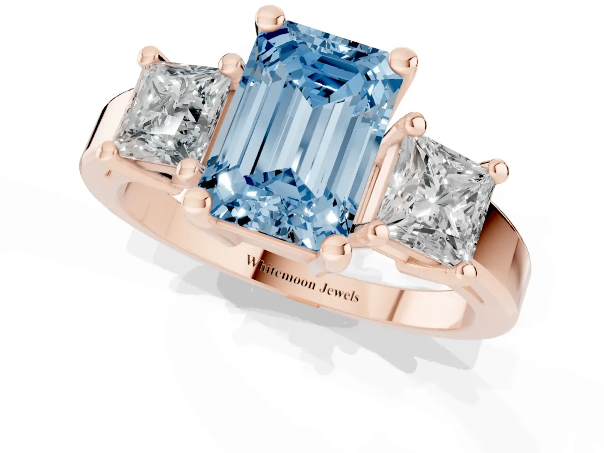 Fancy Blue Three-Stone Emerald Cut Cut Solitaire Ring with Prong Setting Rose gold