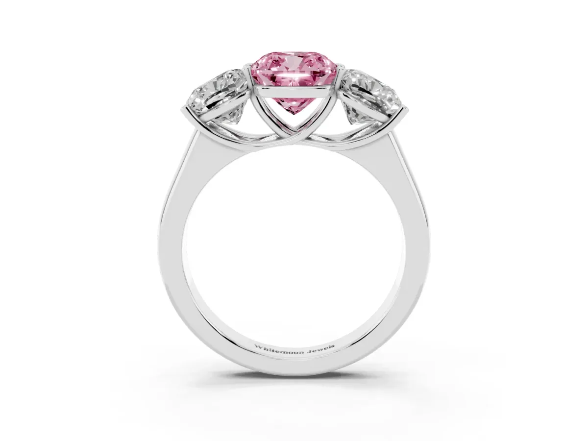 Fancy Pink Cushion Cut Three-Stone Diamond Ring with Prong Setting on a Classic Band Platinum