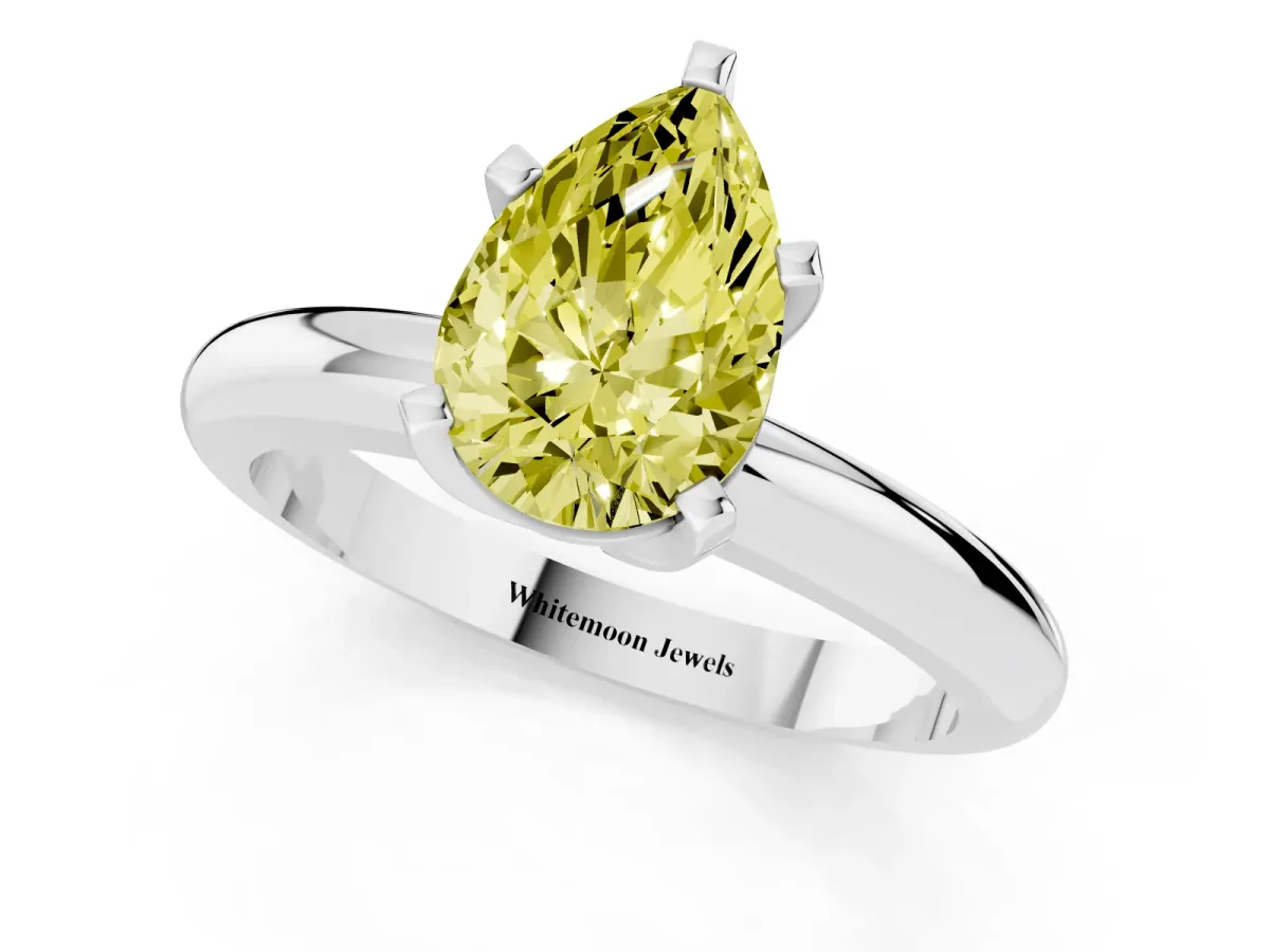 Fancy Yellow Pear Cut Diamond Solitaire Engagement Ring with Round Band and Four-Prong Setting Platinum