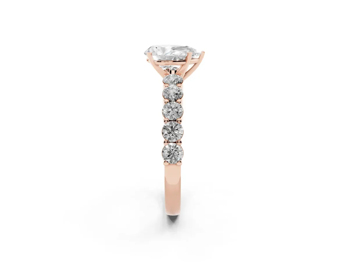 Pear Cut Diamond Solitaire Ring with Shared Prong Round Side Stones Rose gold