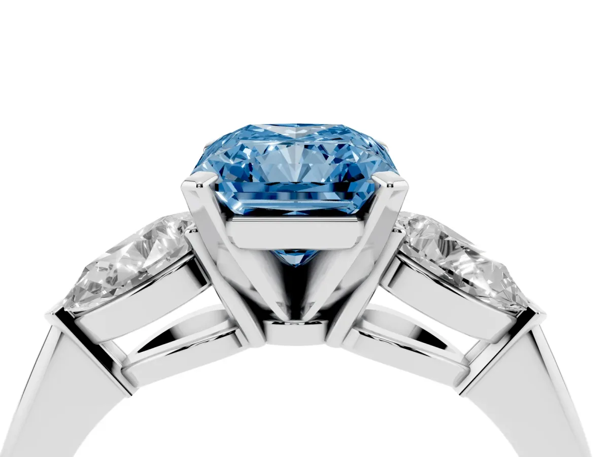 Fancy Blue Three-Stone Radiant Cut Diamond Ring with Pear Side Stones and Four-Prong Setting Platinum