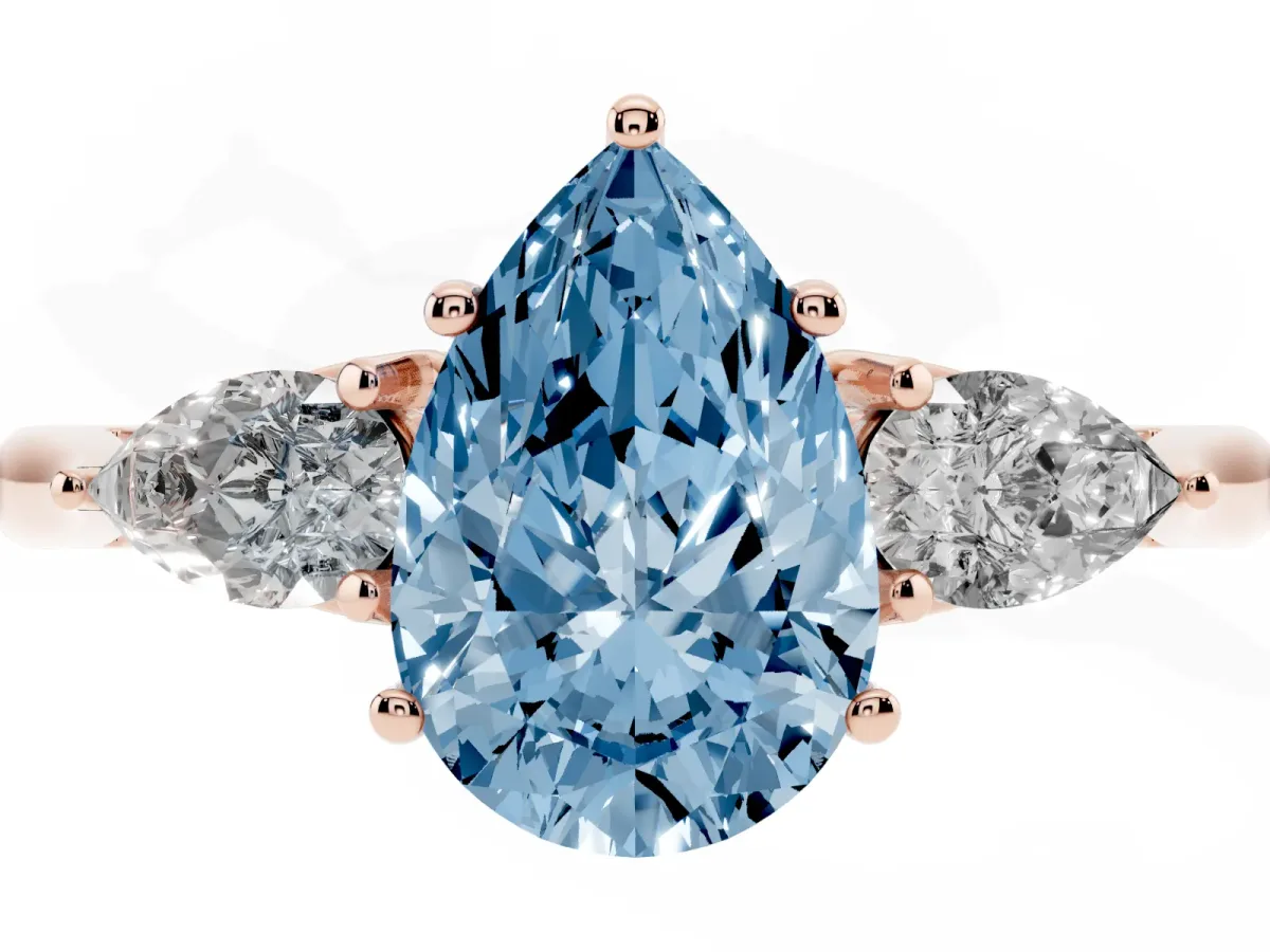 Fancy Blue Three-Stone Pear Cut Brilliant Diamond Solitaire Ring with Tapered Band and Four-Prong Setting Rose gold