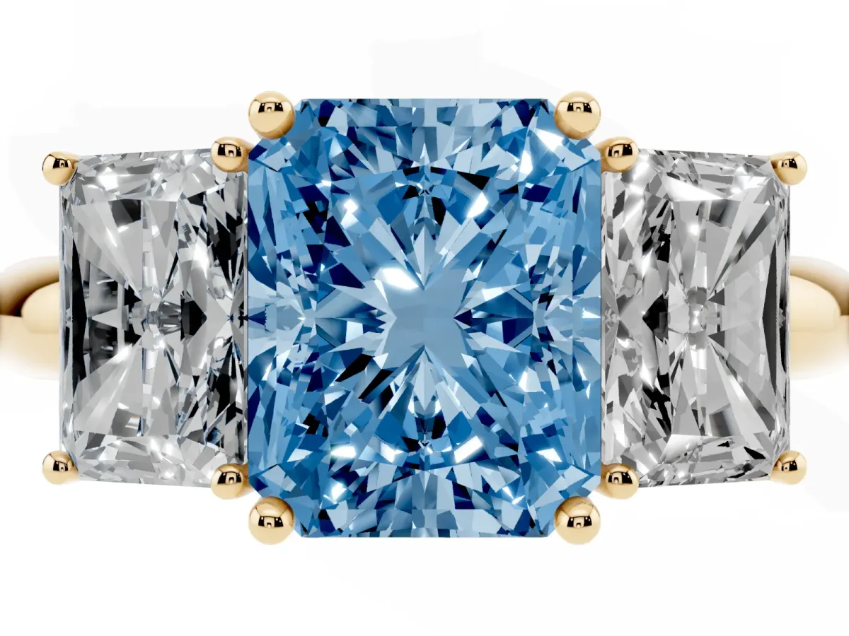 Fancy Blue Three-Stone Radiant Cut Cut Diamond Engagement Ring with Prong Setting on a White Gold Band Yellow gold