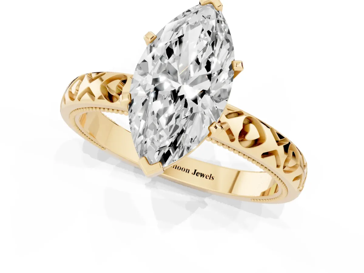 Marquise Cut Solitaire Diamond Engagement Ring with XO Engraved Band and Four-Prong Setting Yellow gold
