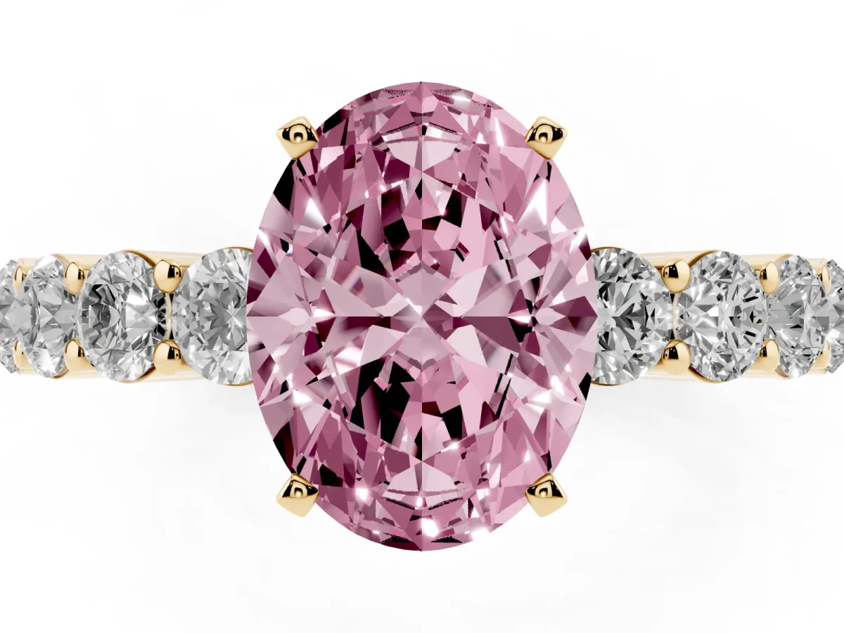 Fancy Pink Oval Cut Diamond Solitaire Ring with Shared Prong Round Side Stones Yellow gold