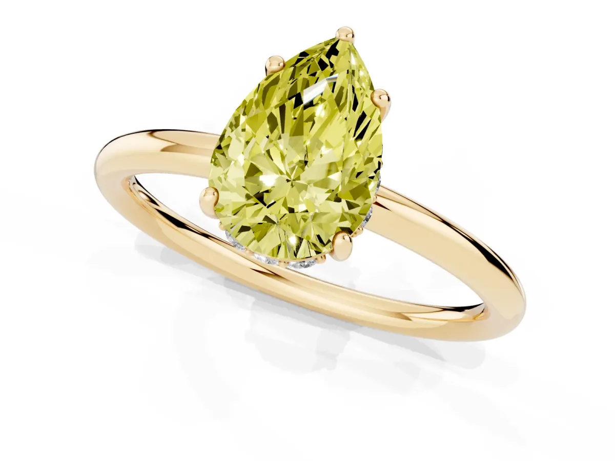 Fancy Yellow Pear Cut Solitaire Diamond Ring with a Classic Band and Four-Prong Setting Yellow gold