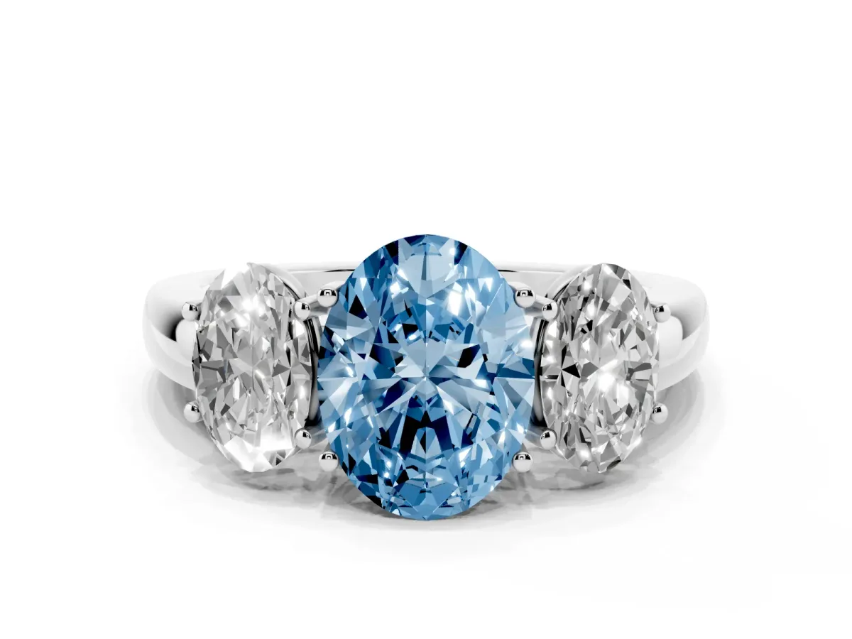 Fancy Blue Oval Cut Diamond Three-Stone Ring with Four-Prong Setting and Classic Band Platinum