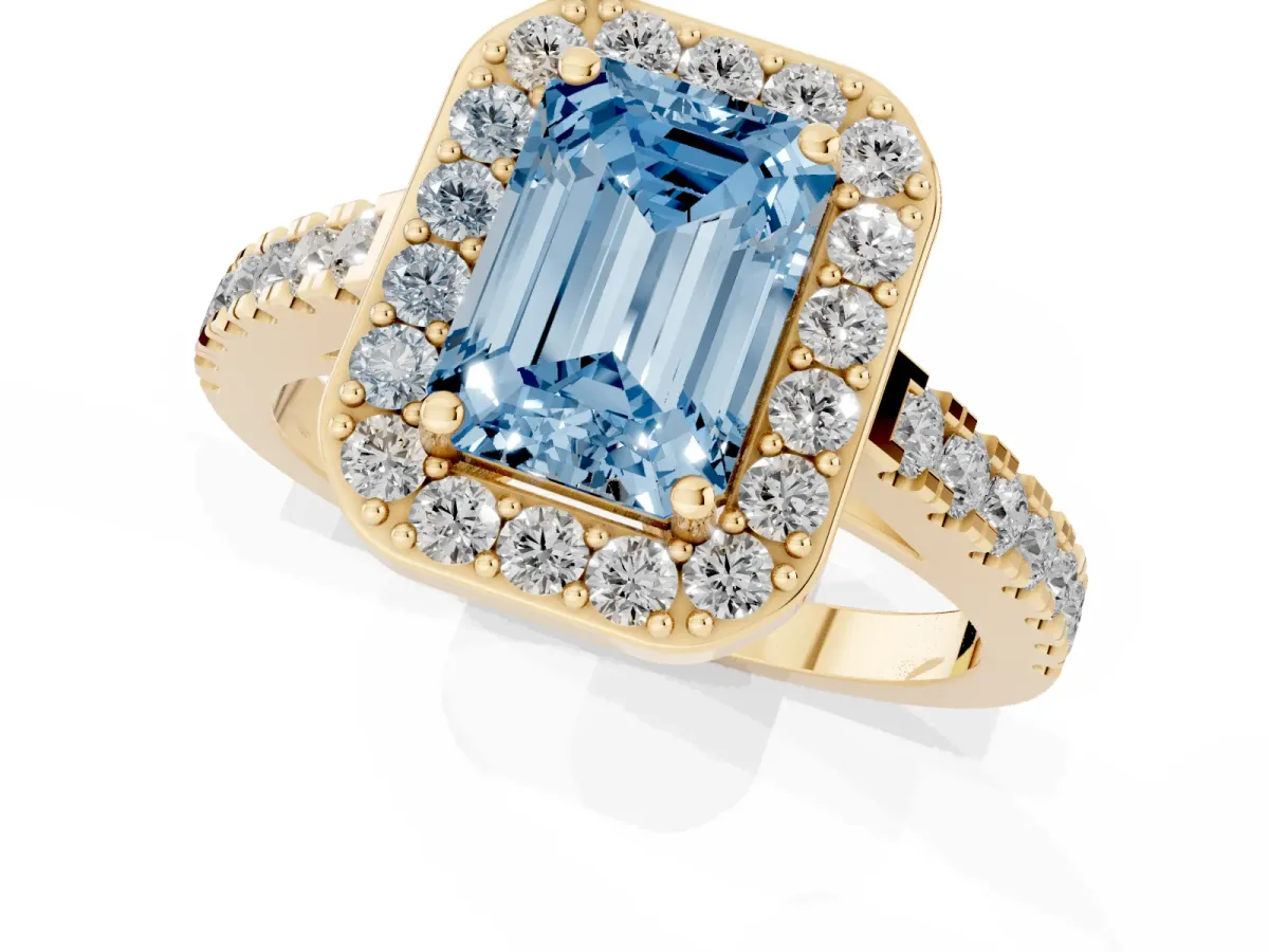 Fancy Blue Emerald Cut Diamond Halo Ring with Round Pavé Split Shank and Prong Setting Yellow gold