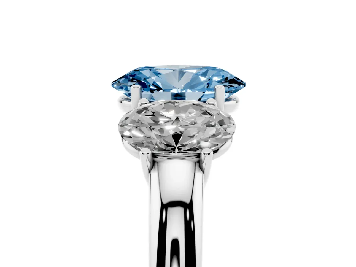 Fancy Blue Oval Cut Diamond Three-Stone Ring with Four-Prong Setting and Classic Band Platinum