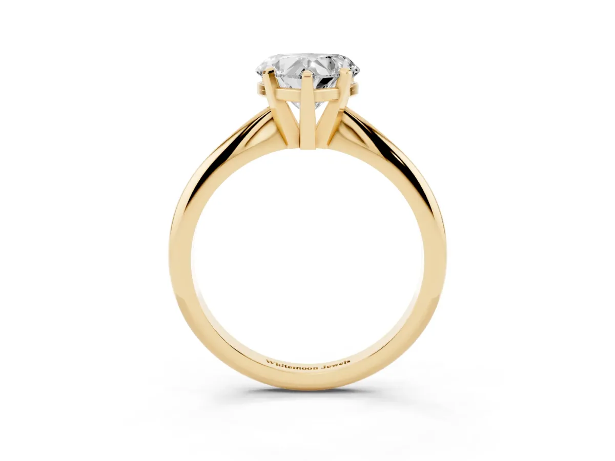 Heart Cut Cut Solitaire Ring with Four-Prong Setting on a Classic Band Yellow gold
