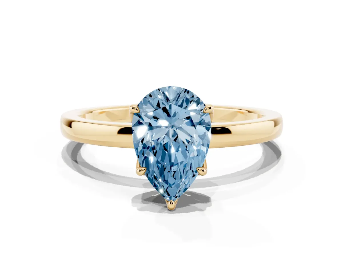 Fancy Blue Pear Cut Diamond Solitaire Ring with Thin Band and Prong Setting Yellow gold