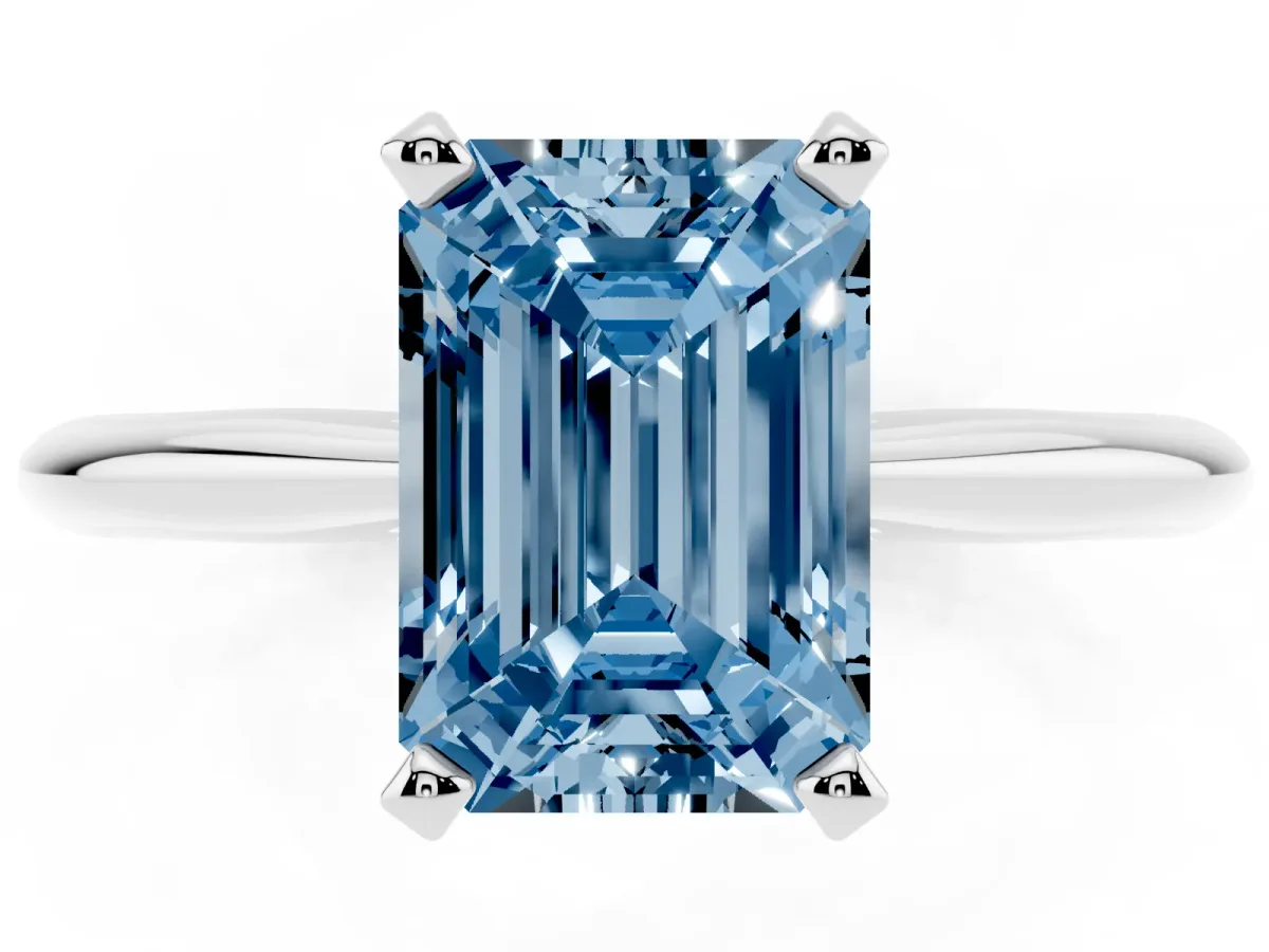 Fancy Blue Emerald Cut Cut Solitaire Ring with Four-Prong Setting on a Classic Band White gold