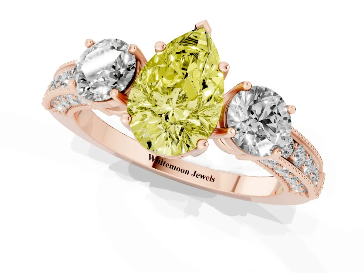 Fancy Yellow Pear Cut Three-Stone Diamond Ring with Pavé Band and Four-Prong Setting Rose gold