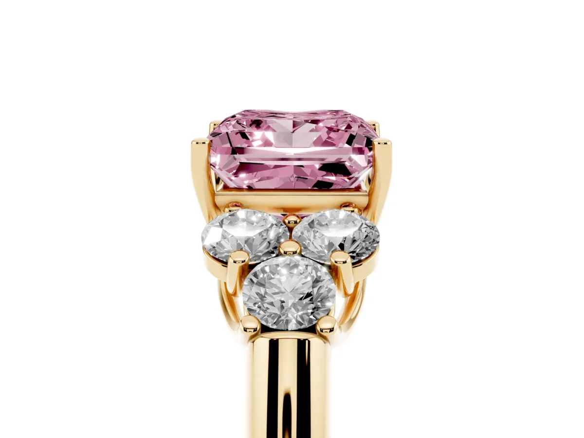 Fancy Pink Princess Cut Cut Diamond Cluster Ring with Round Accent Stones and Prong Setting on a Classic Band Yellow gold