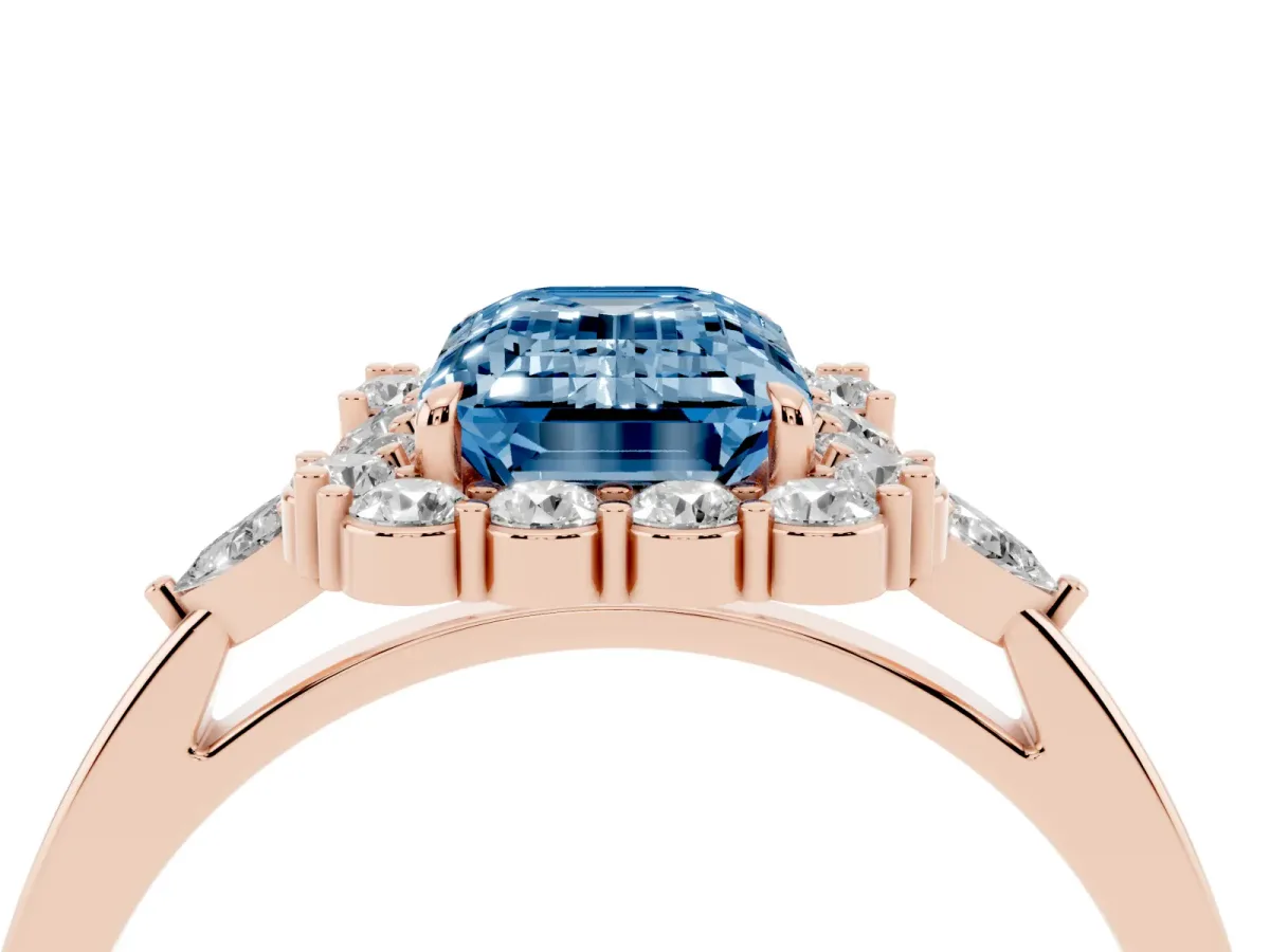 Fancy Blue Emerald Cut Diamond Halo Ring with Pear Side Stones and Prong Setting Rose gold