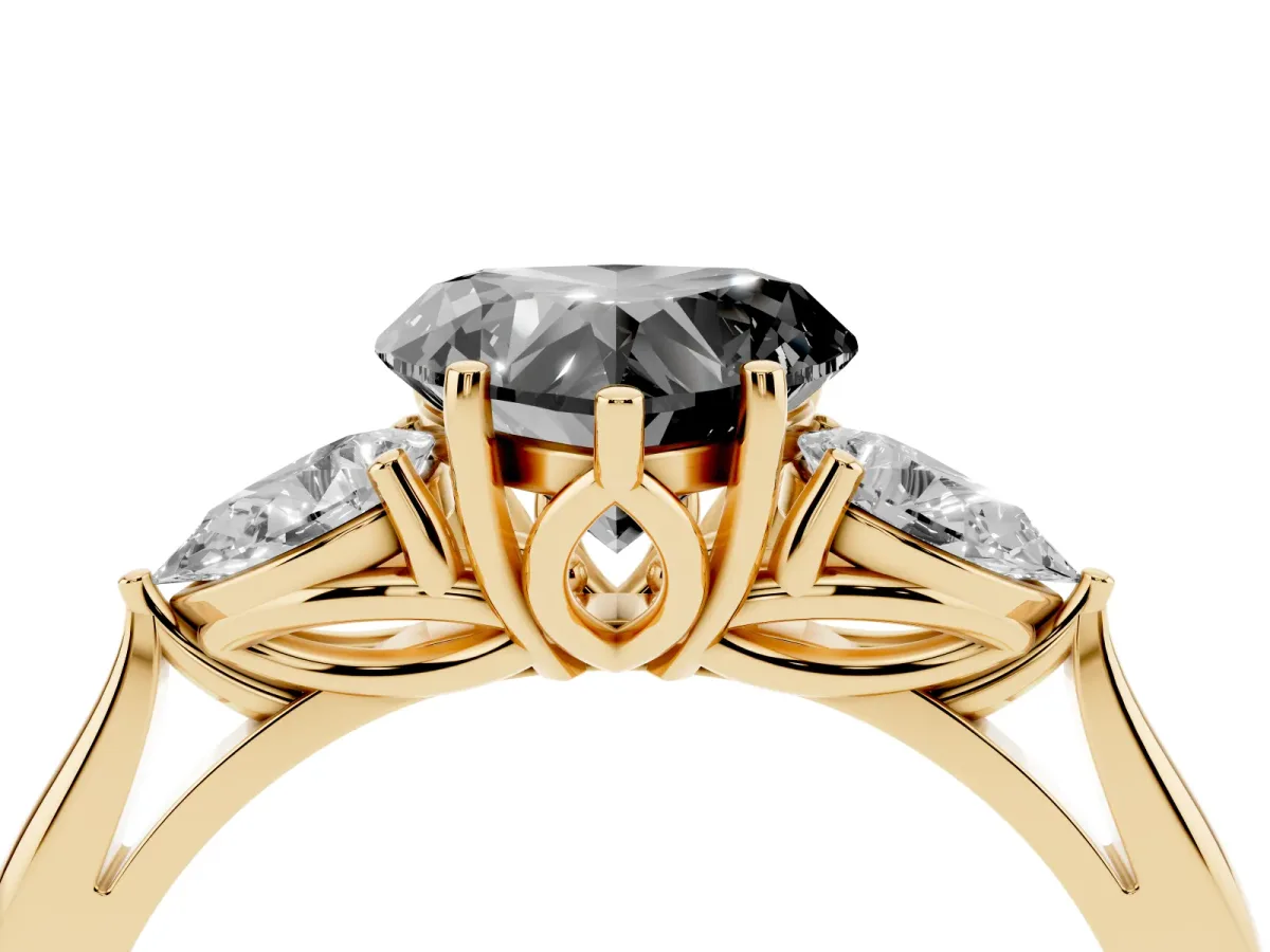 Fancy Black Heart Cut Diamond Three-Stone Ring with Pear Side Stones and Prong Setting Yellow gold