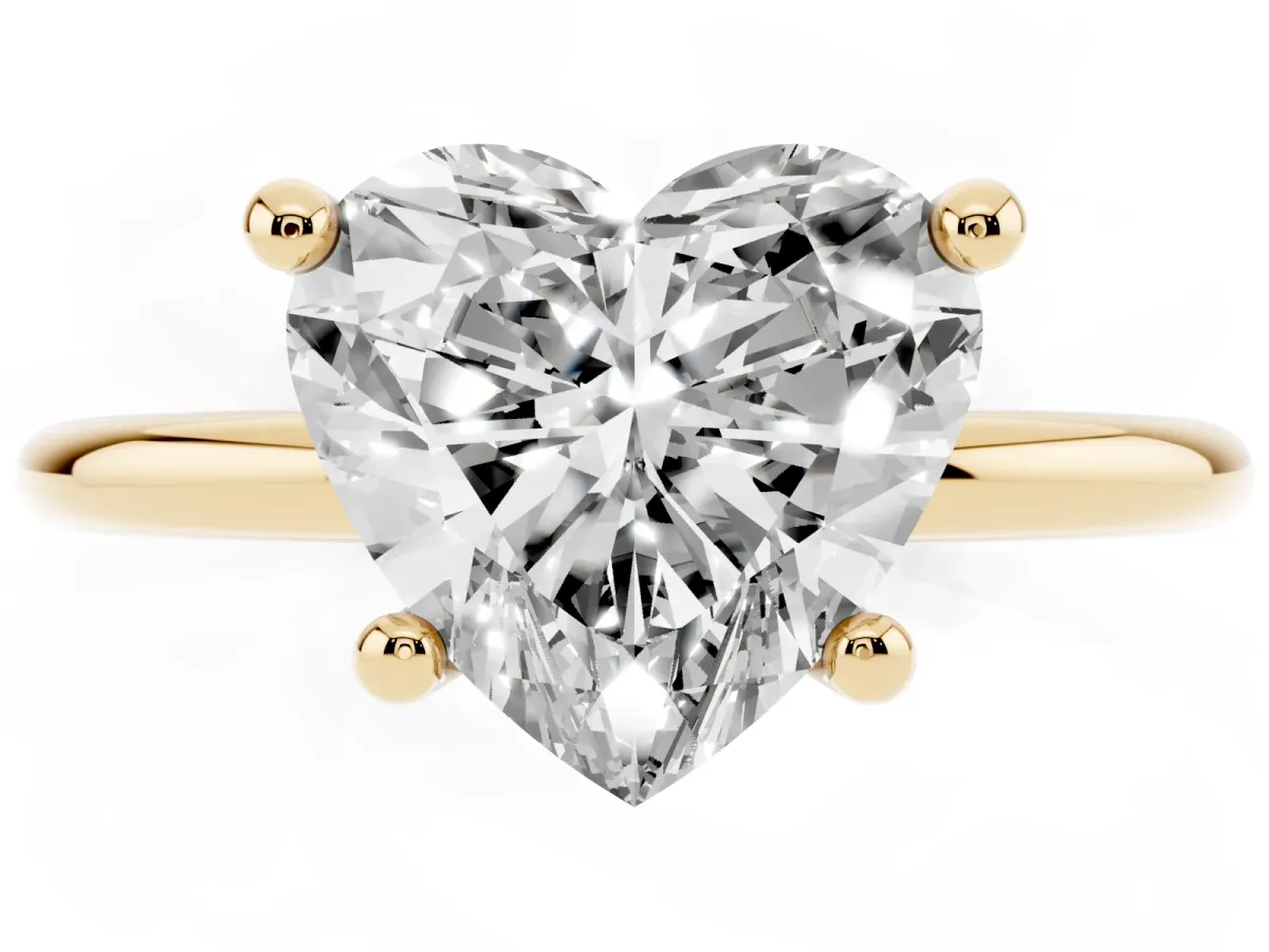 Heart Cut Solitaire Diamond Ring with 4-Prong Setting on a Classic Band Yellow gold