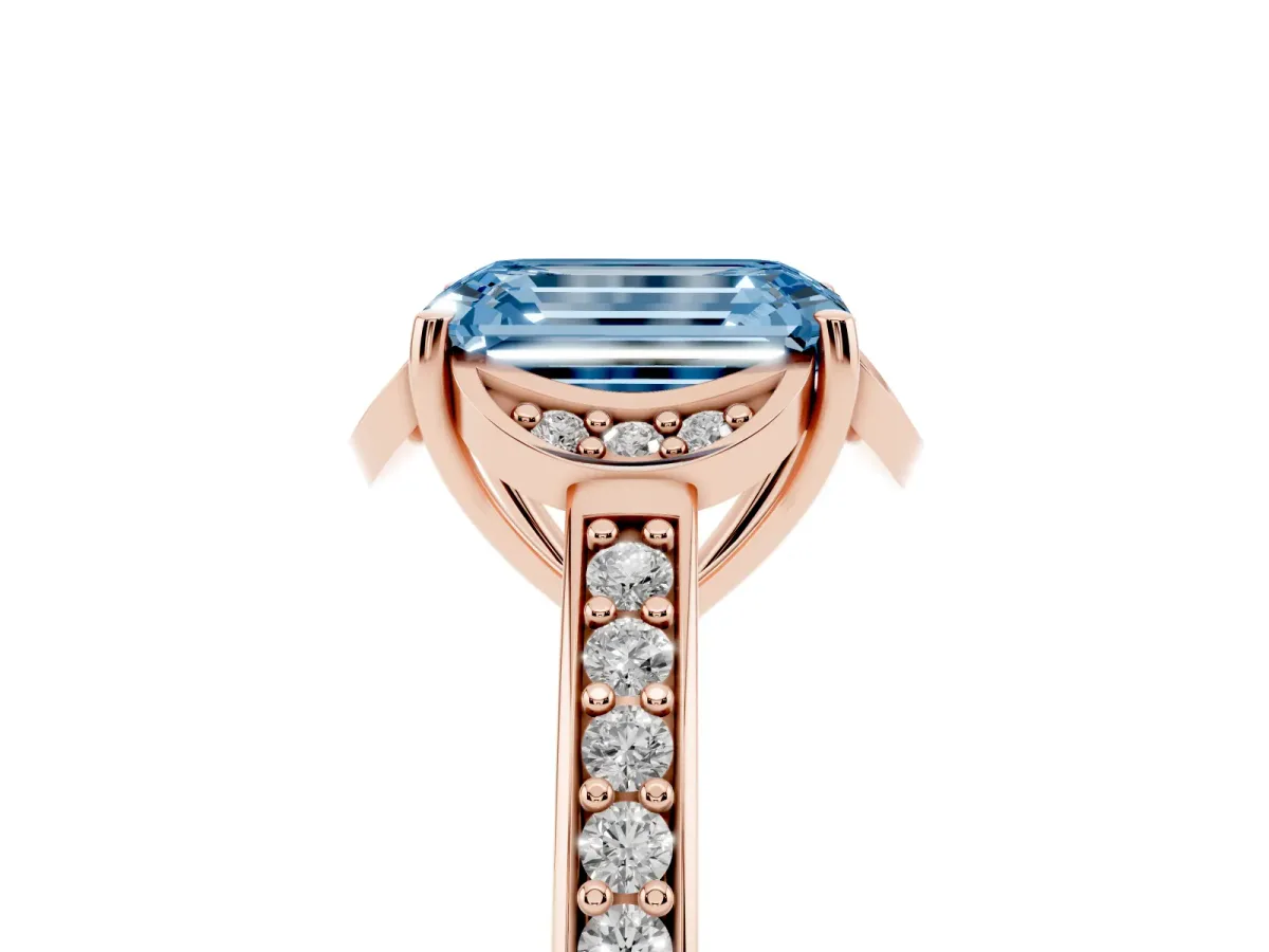 Fancy Blue Emerald Cut Cut Halo Diamond Ring with Channel Set Band and Four-Prong Setting Rose gold