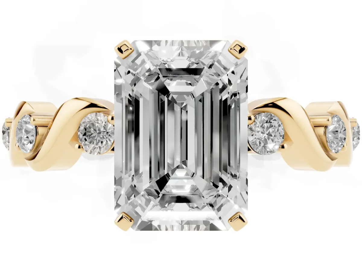 Emerald Cut Diamond Solitaire Twisted Band with Round Accents and Prong Setting Yellow gold