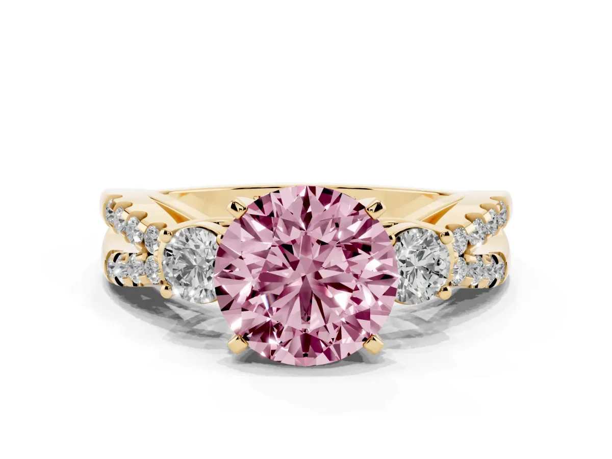 Fancy Pink Round Cut Diamond Three-Stone Ring with Pavé Split Shank and Four-Prong Setting Yellow gold