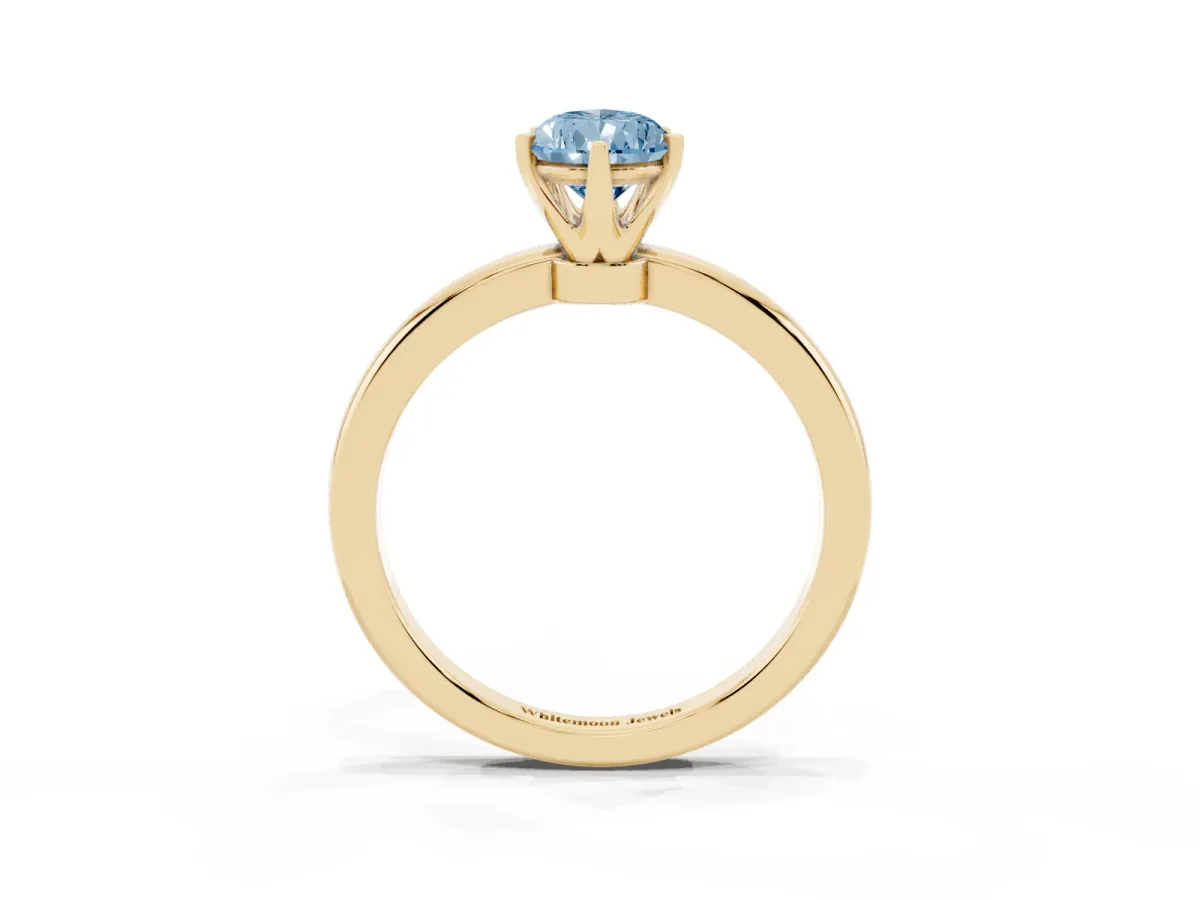 Fancy Blue Pear Cut Solitaire Diamond Ring with Six-Prong Setting on a Classic Band Yellow gold