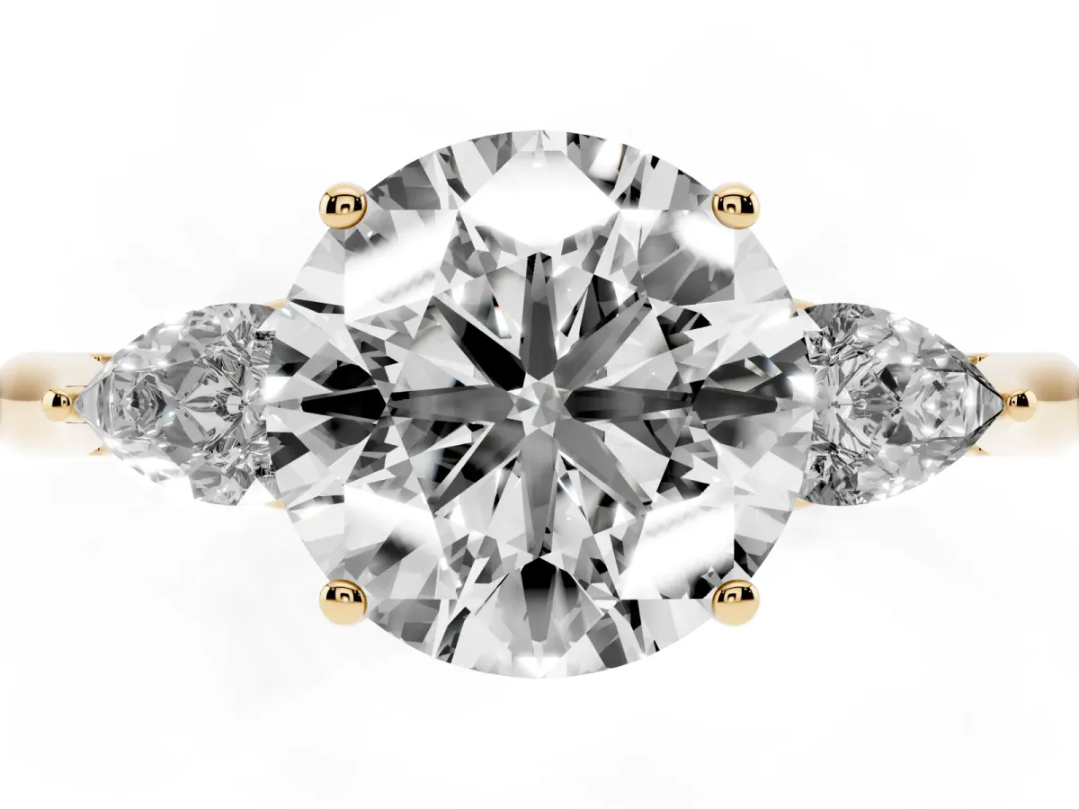 Round Cut Diamond Three-Stone Ring with Pear Side Stones and Prong Setting Yellow gold