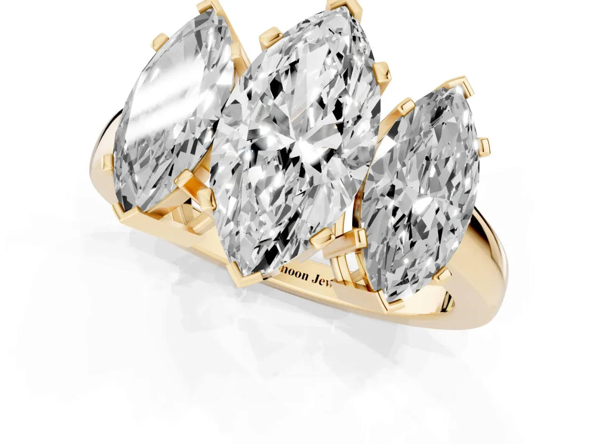 Three-Stone Marquise Cut Cut Diamond Ring with Channel Set Band and Four-Prong Setting Yellow gold
