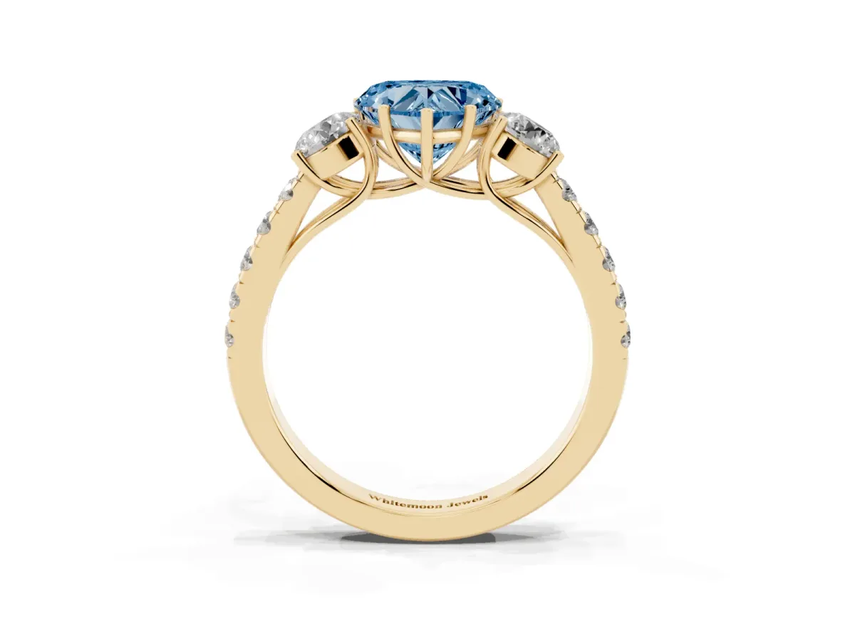 Fancy Blue Heart Cut Cut Diamond Three-Stone Ring with Round Side Stones and Pavé Band Yellow gold