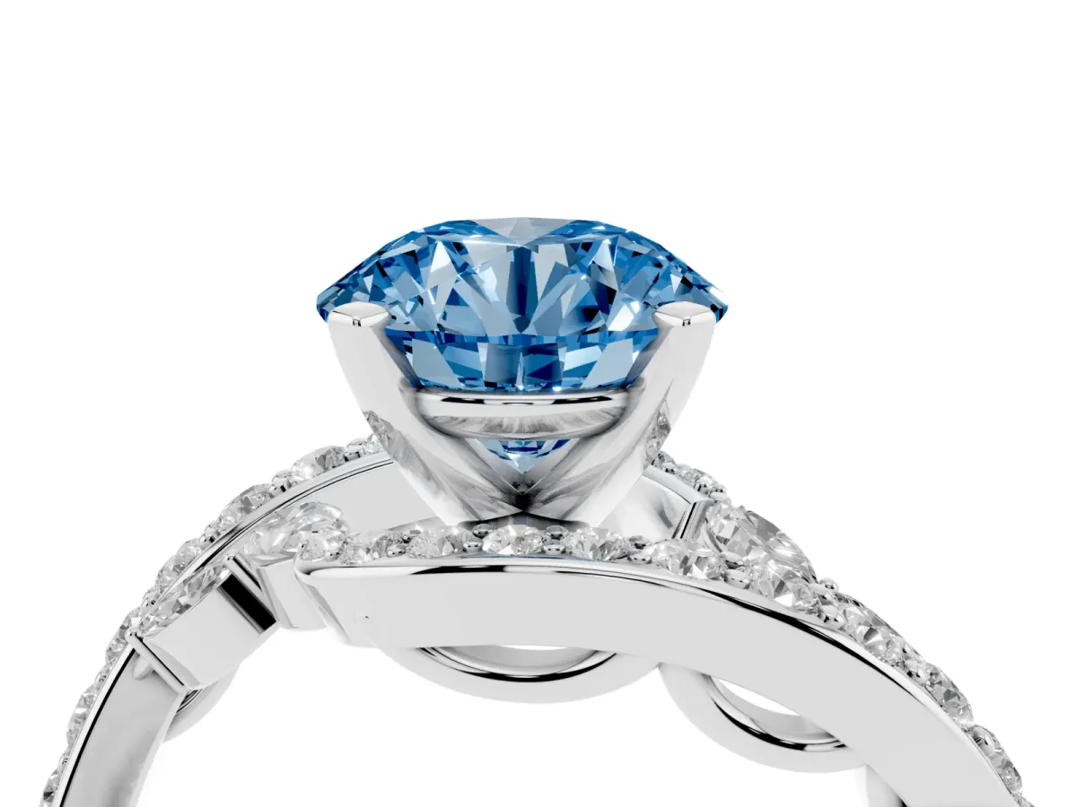 Fancy Blue Round Cut Solitaire with Pavé Twist Band and Four-Prong Setting Silver