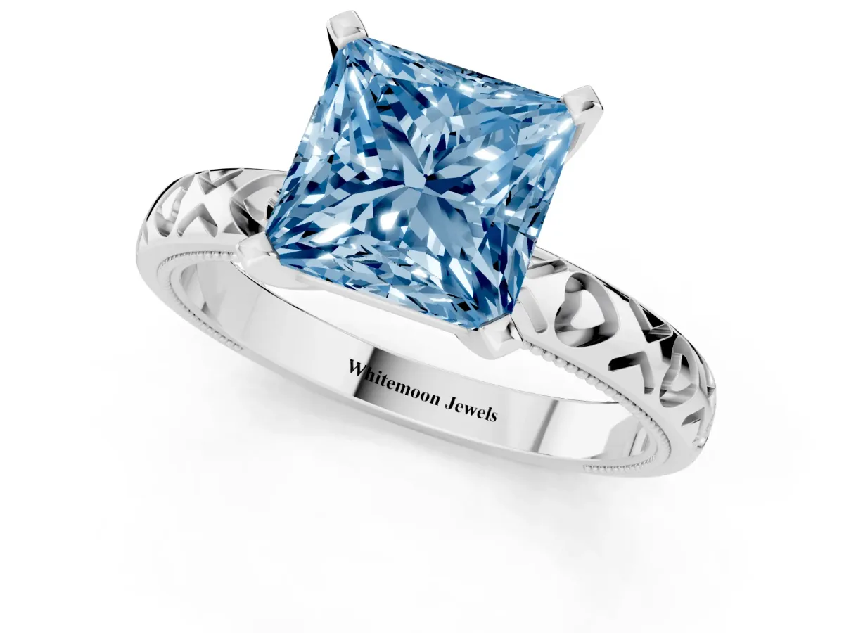 Fancy Blue Princess Cut Solitaire Diamond Engagement Ring with XO Engraved Band and Four-Prong Setting Silver