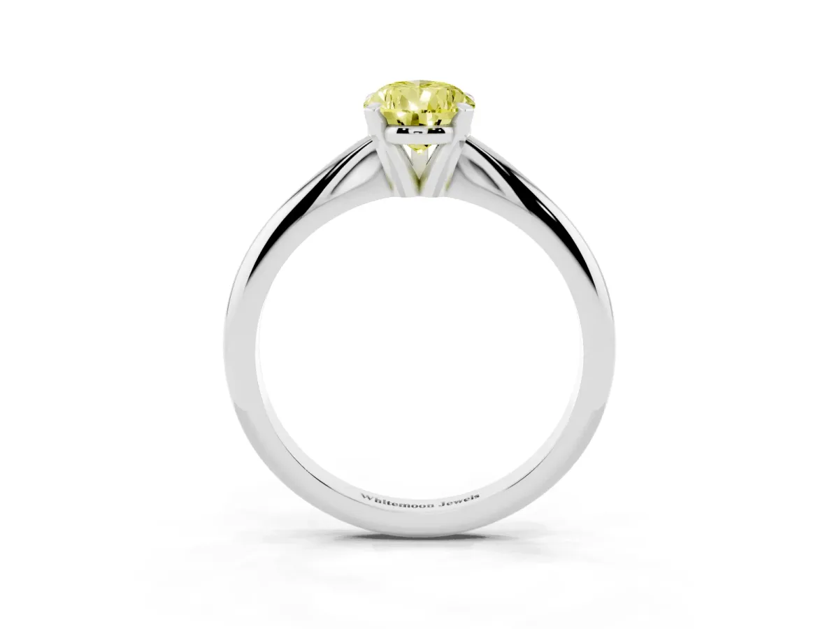 Fancy Yellow Pear Cut Cut Solitaire Ring with Four-Prong Setting on a Classic Band Silver