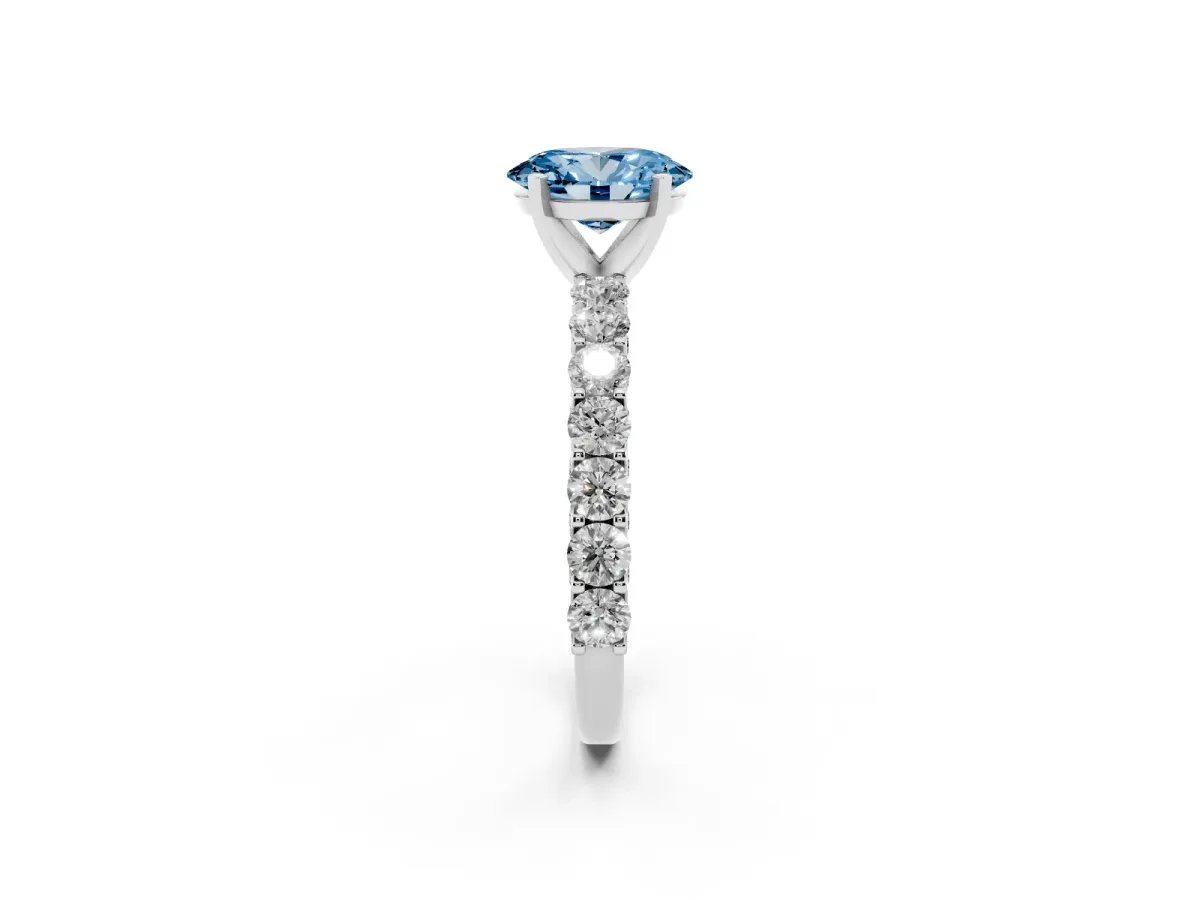 Fancy Blue Oval Cut Diamond Solitaire Ring with Shared Prong Pavé Band and Four-Prong Setting Silver