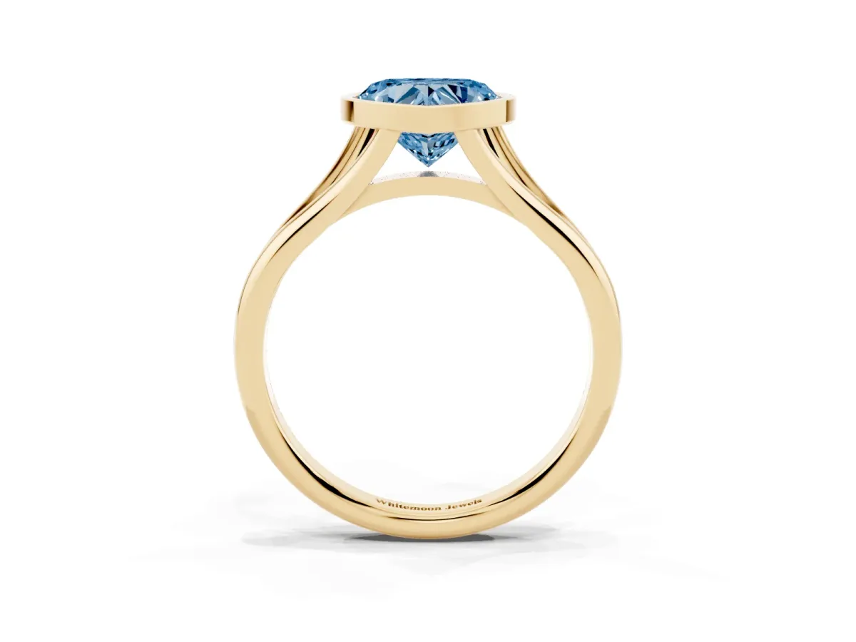 Fancy Blue Bezel Set Heart Cut Cut Solitaire Ring with Tapered Band Yellow gold