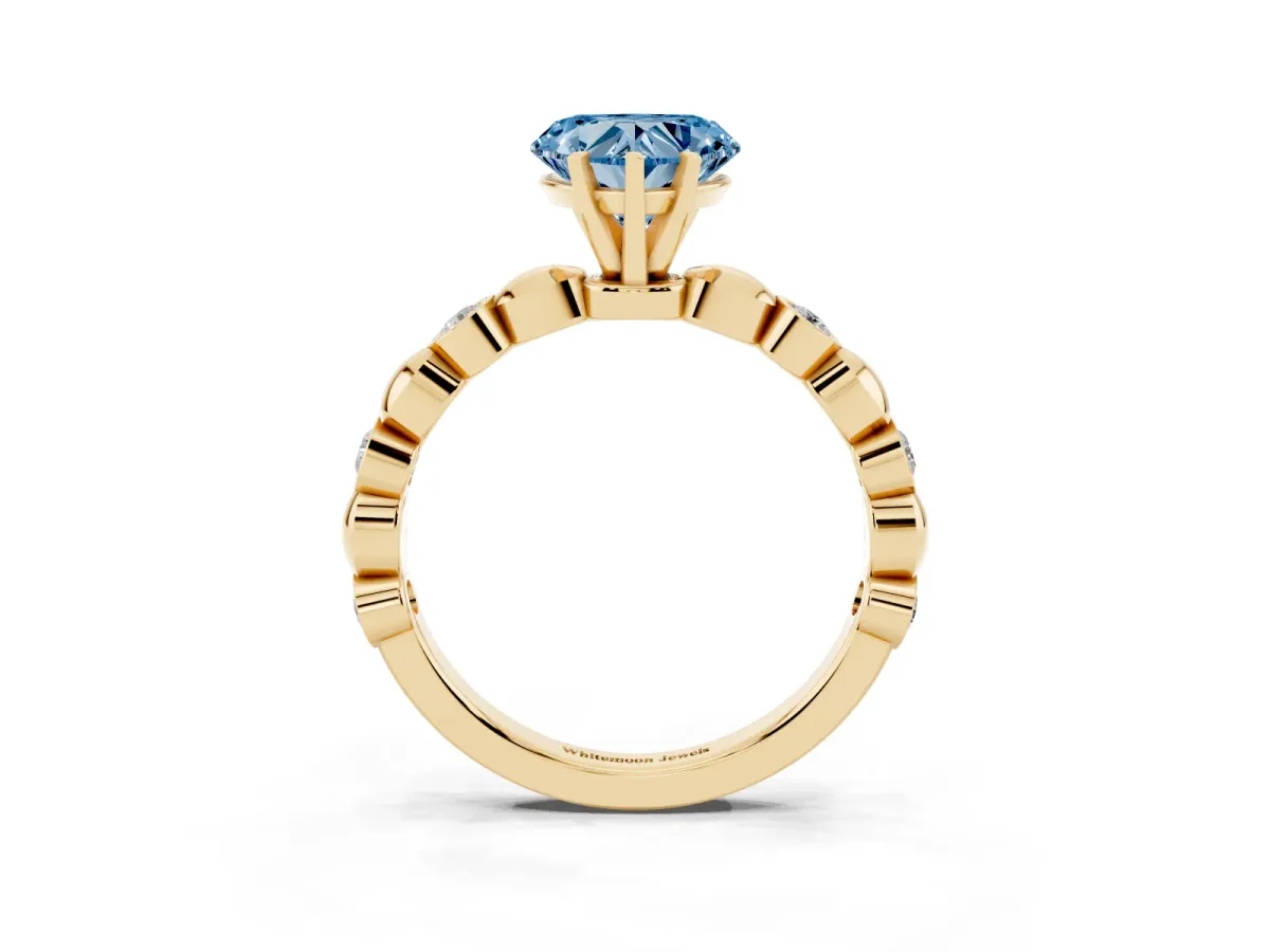Fancy Blue Heart Cut Solitaire Bezel-Set Diamond Ring with Beaded Band and Four-Prong Setting Yellow gold
