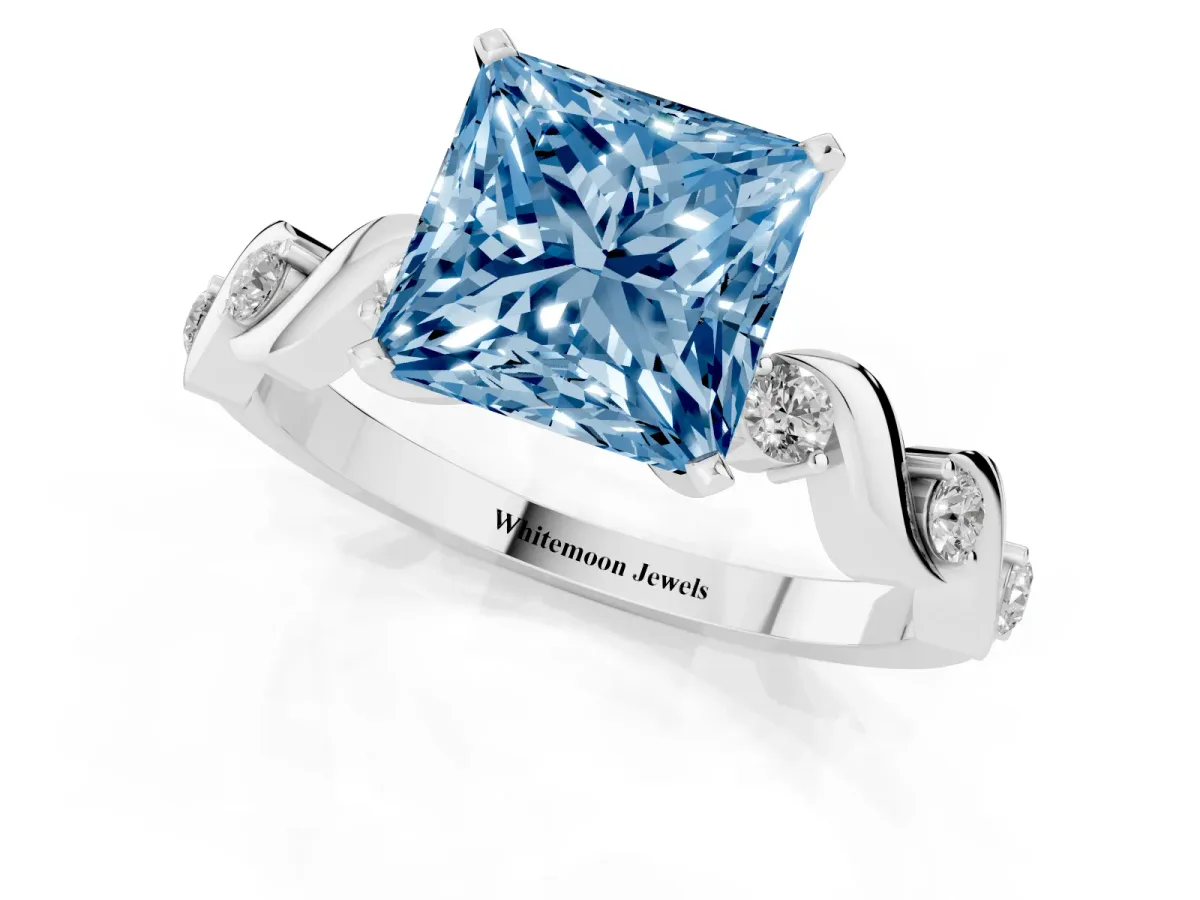 Fancy Blue Princess Cut Diamond Solitaire Twisted Band with Round Accents and Prong Setting White gold