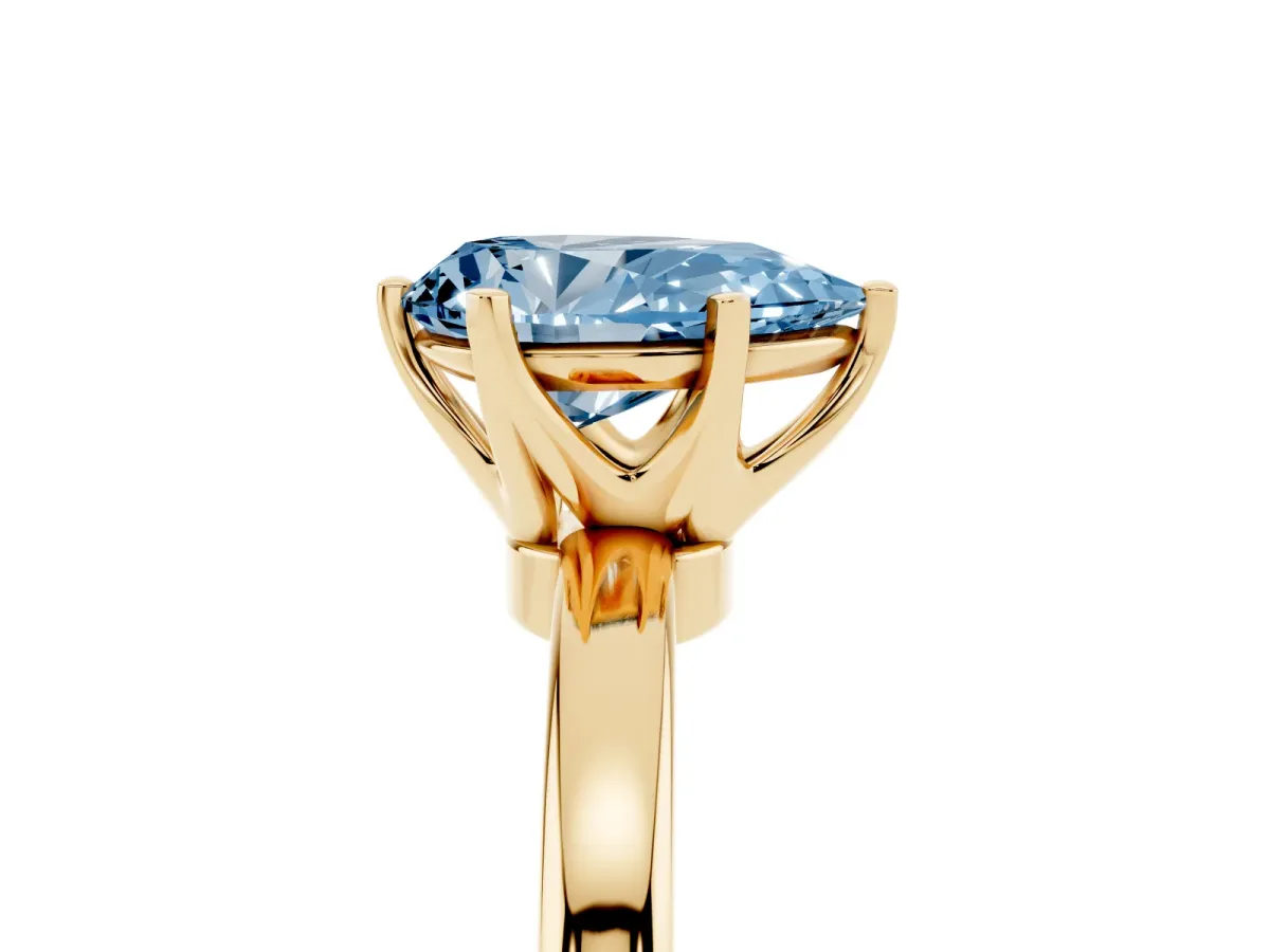 Fancy Blue Pear Cut Solitaire Diamond Ring with Six-Prong Setting on a Classic Band Yellow gold