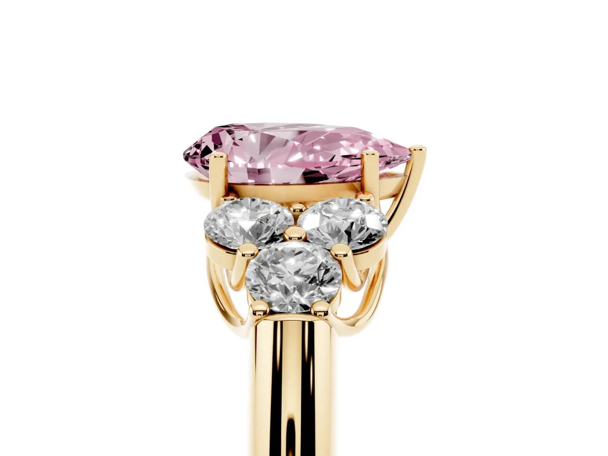 Fancy Pink Pear Cut Cut Diamond Cluster Ring with Round Accent Stones and Prong Setting on a Classic Band Yellow gold