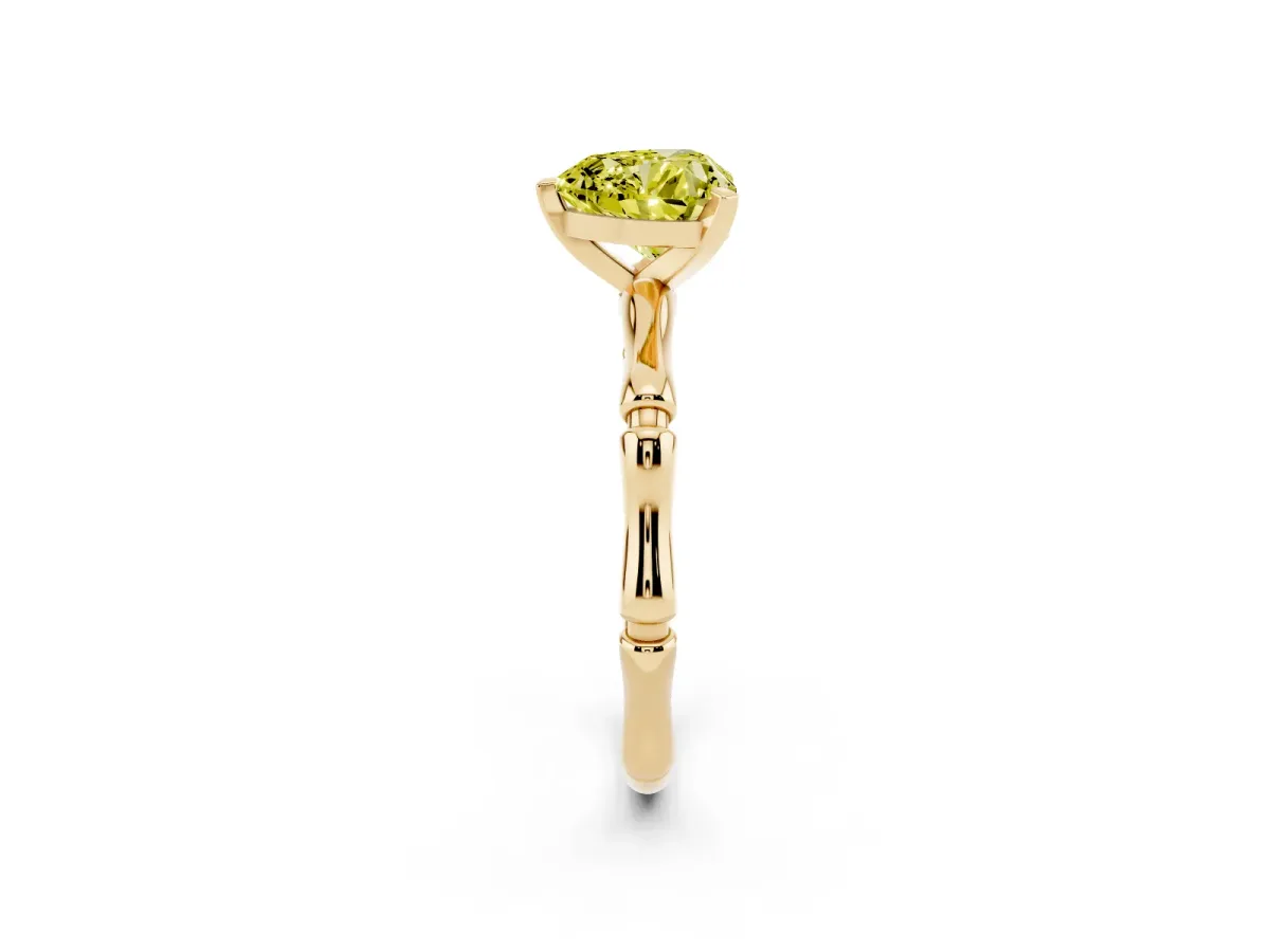 Fancy Yellow Heart Cut Solitaire Diamond Ring with Bamboo Band and Four-Prong Setting Yellow gold