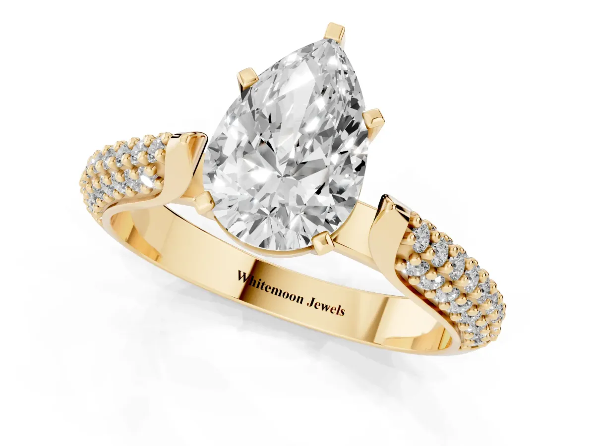Pear Cut Diamond Solitaire Engagement Ring with Multi-Row Round Pavé Band and Prong Setting Yellow gold