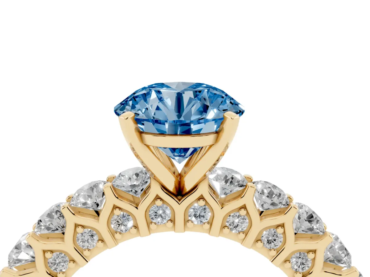 Fancy Blue Round Cut Diamond Solitaire Ring with Shared Prong Pavé Band and Four-Prong Setting Yellow gold