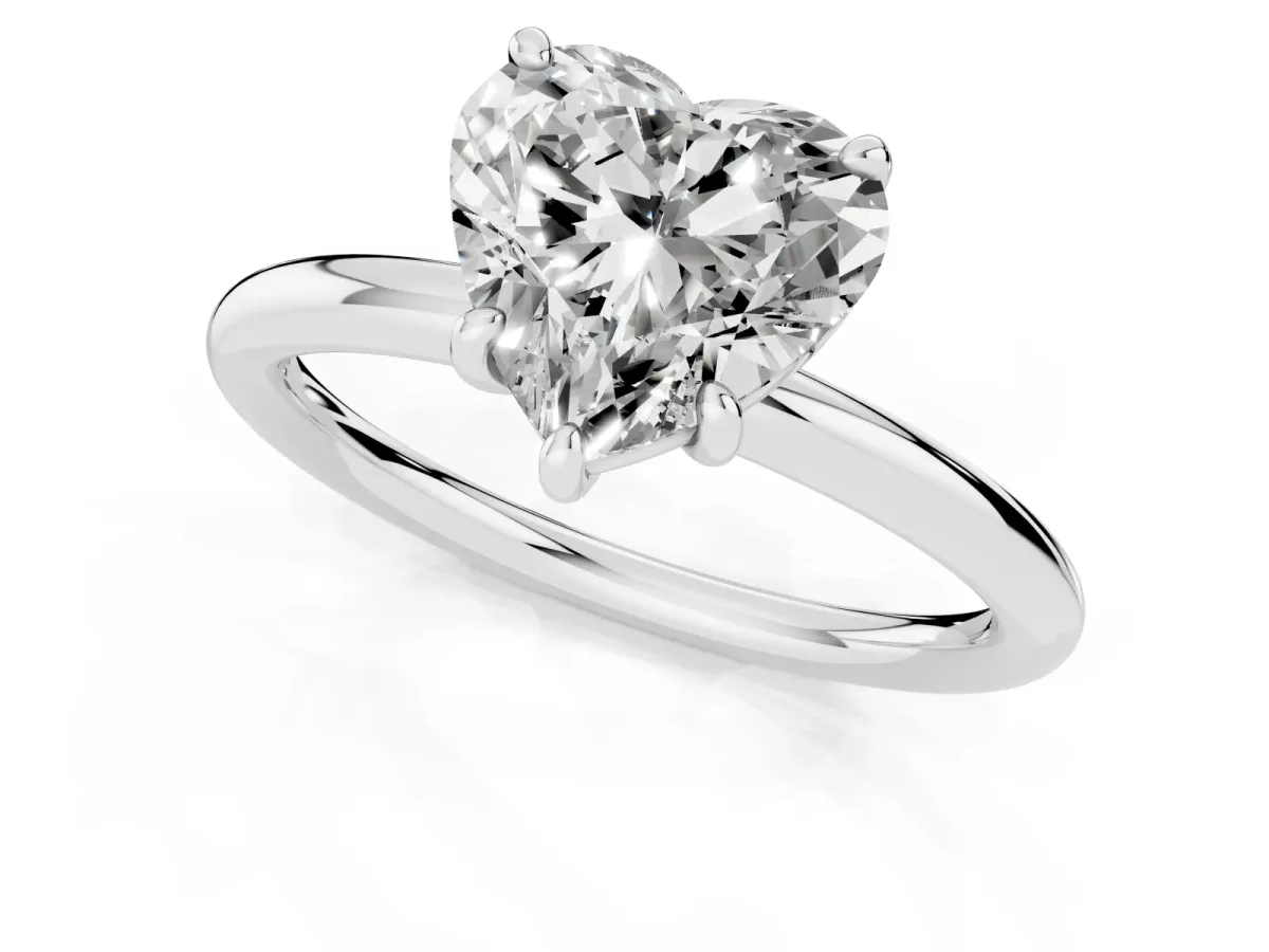 Heart Cut Solitaire Diamond Ring with Four-Prong Setting on a Plain Band Platinum