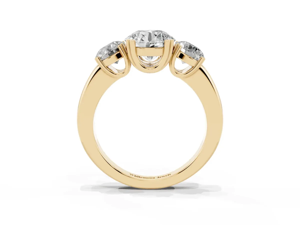 Three-Stone Round Cut Cut Diamond Ring with Channel Set Band and Four-Prong Setting Yellow gold