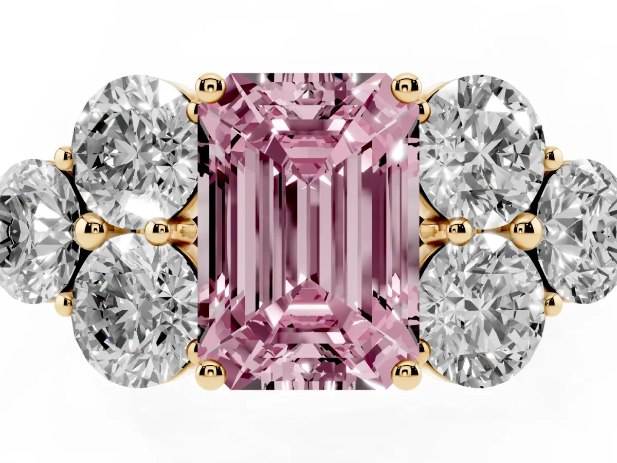 Fancy Pink Emerald Cut Cut Diamond Cluster Ring with Round Accent Stones and Prong Setting on a Classic Band Yellow gold