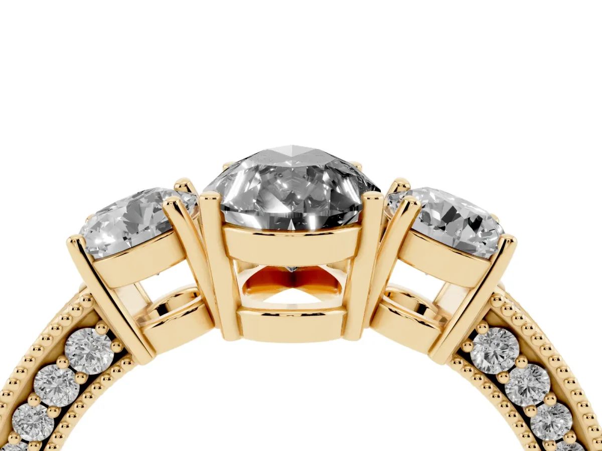 Fancy Black Pear Cut Three-Stone Diamond Ring with Pavé Band and Four-Prong Setting Yellow gold