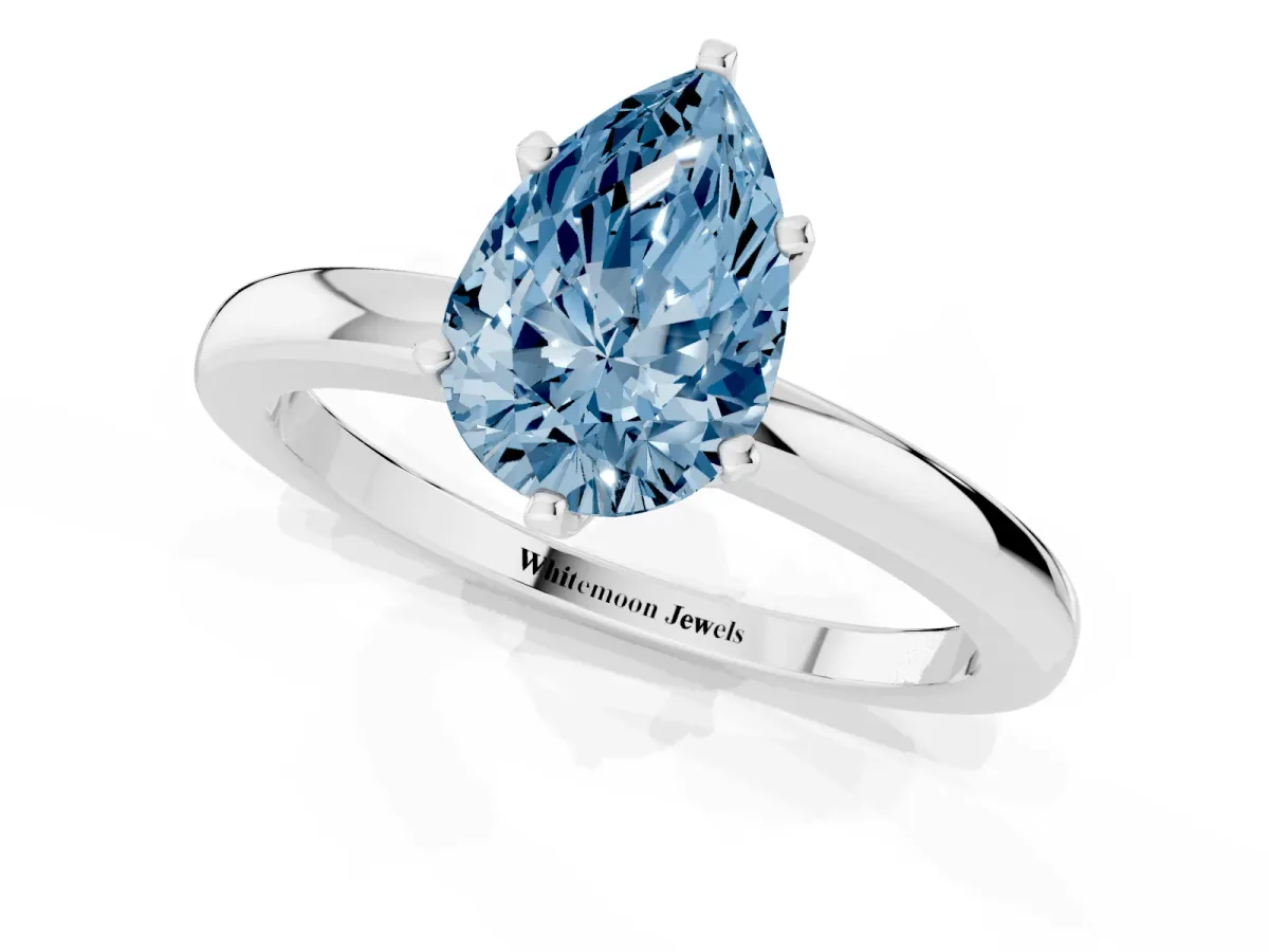 Fancy Blue Pear Cut Solitaire Diamond Ring with Six-Prong Setting on a Classic Band Platinum
