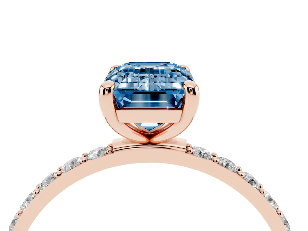 Fancy Blue Emerald Cut Diamond Solitaire Ring with Round Pavé Band and Prong Setting Rose gold