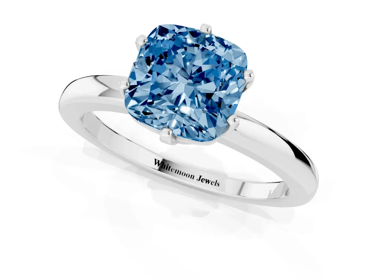 Fancy Blue Cushion Cut Solitaire Diamond Ring with Six-Prong Setting on a Classic Band Platinum