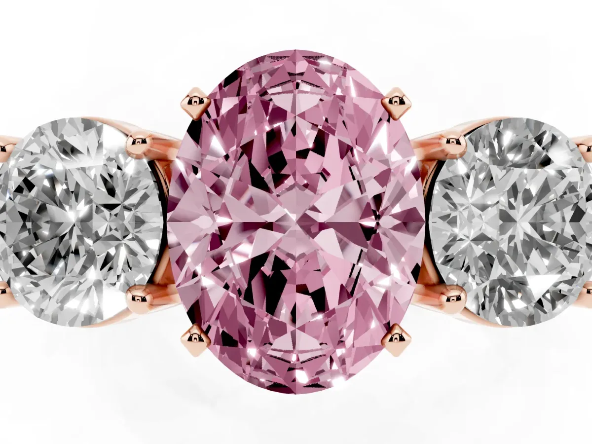 Fancy Pink Three-Stone Oval Cut Diamond Ring with Round Side Stones, Classic Band, and Four-Prong Setting Rose gold